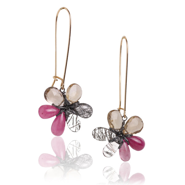 Pink, tan and black and white stone flower earrings hanging from long gold fill earwire.