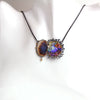 Same agate and opal pendant shown on a white necklace bust display.